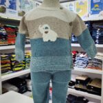 Conjunto de ropa para niño color beige con café y azul con un elefante bordado al centro